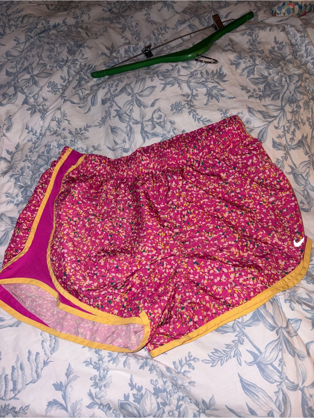 Nike Women's Pink Floral Athletic Shorts with Yellow Trim